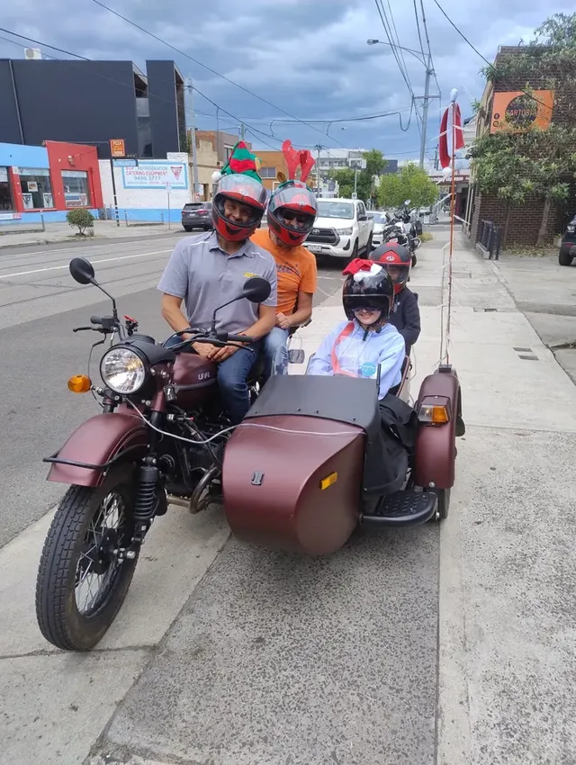 Young sidecar passengers with the driver